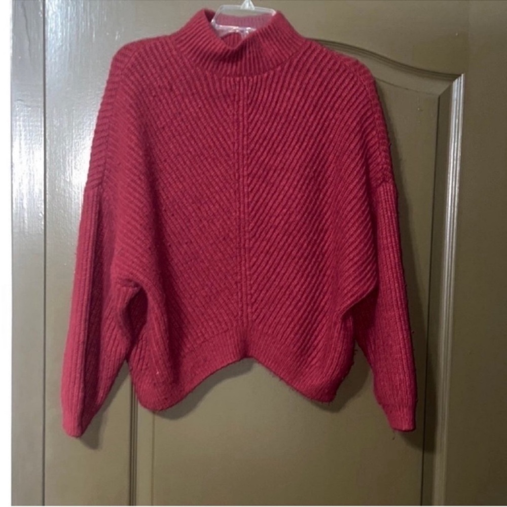 Express wine’s red sweater